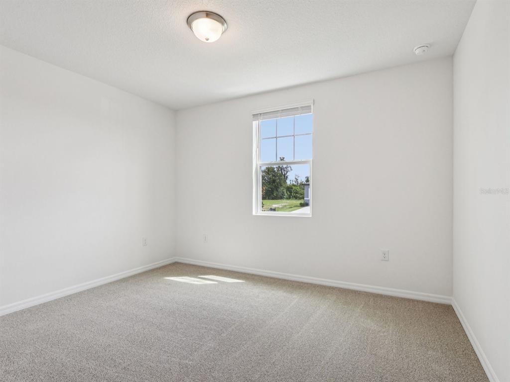 1646 Bark Rdg Drive Auburndale, FL 33823 - Photo 16 of 34 an empty room with a window