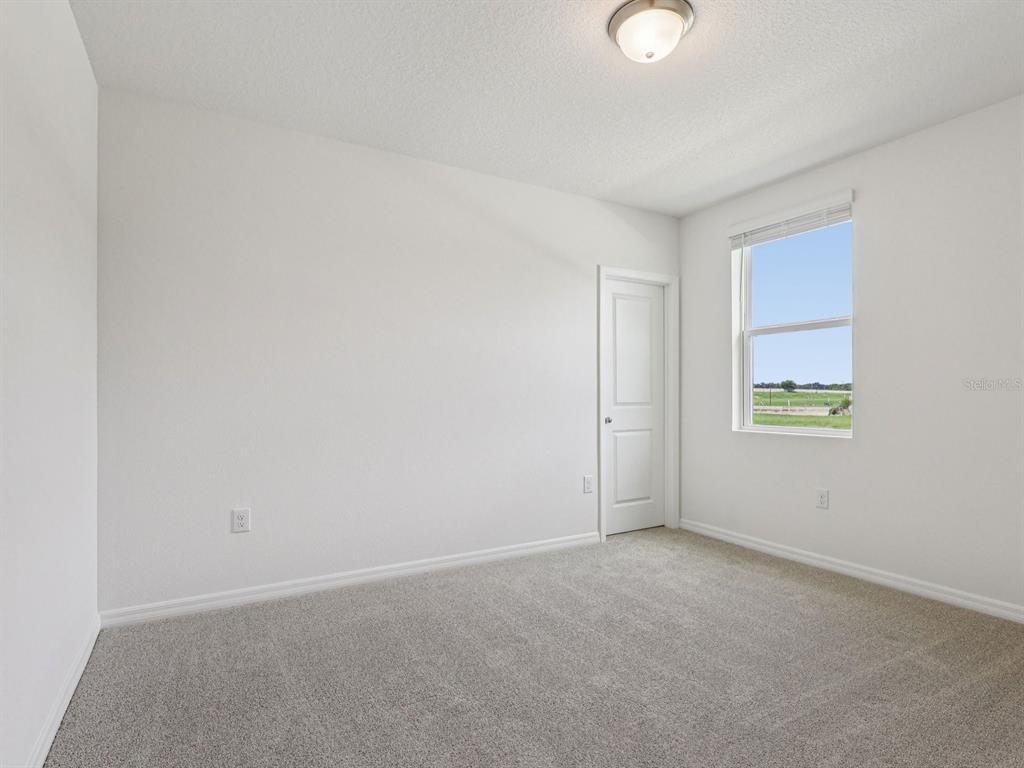 1646 Bark Rdg Drive Auburndale, FL 33823 - Photo 19 of 34 a view of an empty room with a window