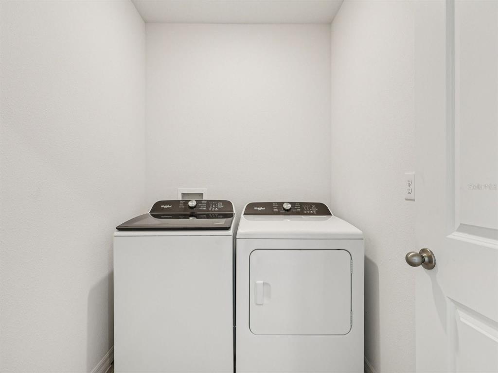 1646 Bark Rdg Drive Auburndale, FL 33823 - Photo 22 of 34 a utility room with dryer and washer