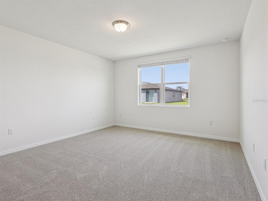 1646 Bark Rdg Drive Auburndale, FL 33823 - Photo 23 of 34 an empty room with a window