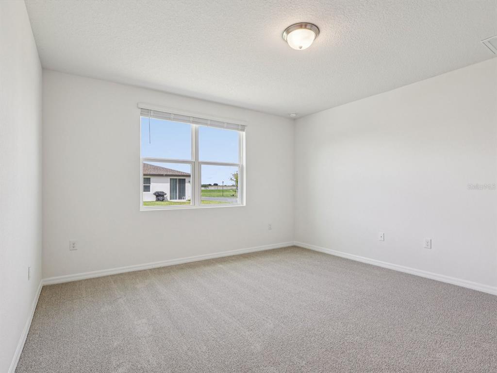 1646 Bark Rdg Drive Auburndale, FL 33823 - Photo 24 of 34 an empty room with windows