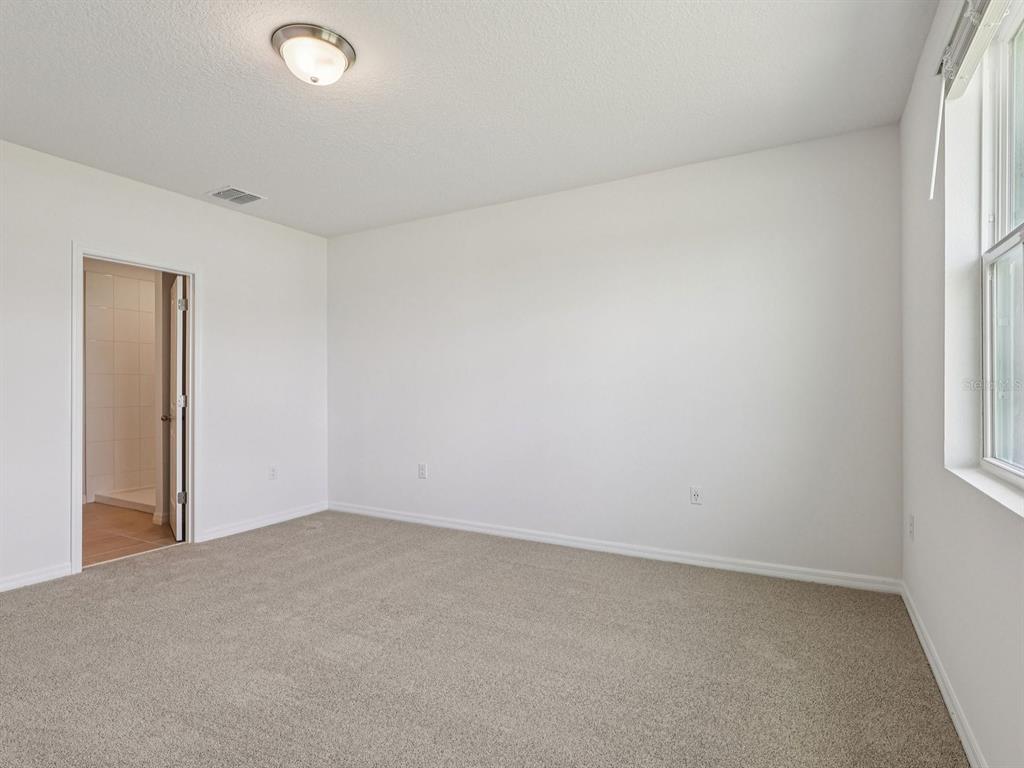 1646 Bark Rdg Drive Auburndale, FL 33823 - Photo 25 of 34 an empty room with a window