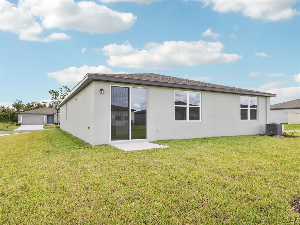 1646 Bark Rdg Drive Auburndale, FL 33823 - Photo 32 of 34 a view of a house with a backyard