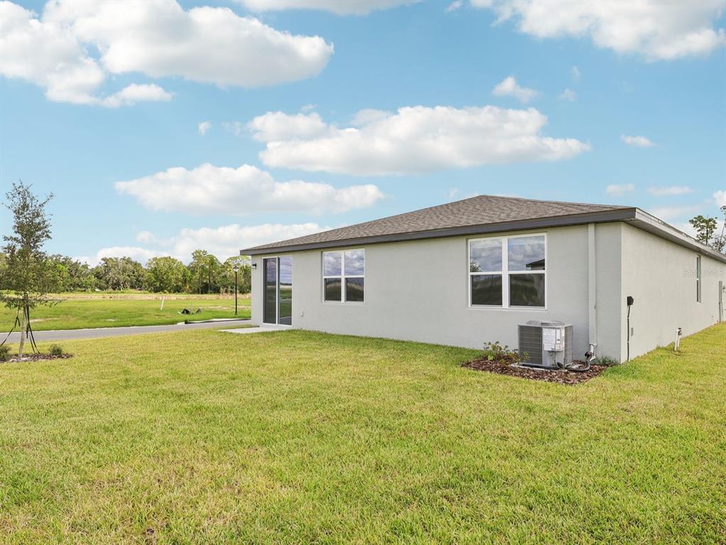 1646 Bark Rdg Drive Auburndale, FL 33823 - Photo 33 of 34 a view of a house with yard and sitting area