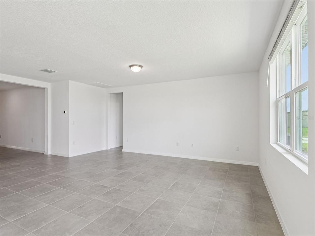 1646 Bark Rdg Drive Auburndale, FL 33823 - Photo 6 of 34 an empty room with windows