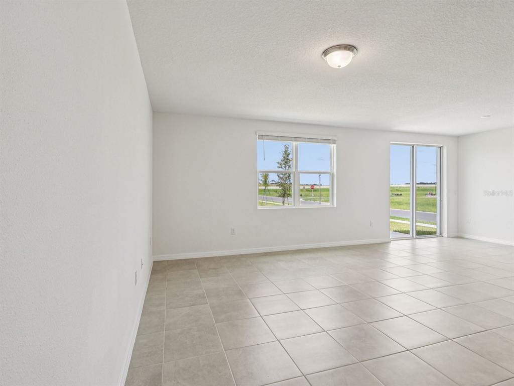 1646 Bark Rdg Drive Auburndale, FL 33823 - Photo 8 of 34 an empty room with windows and closet