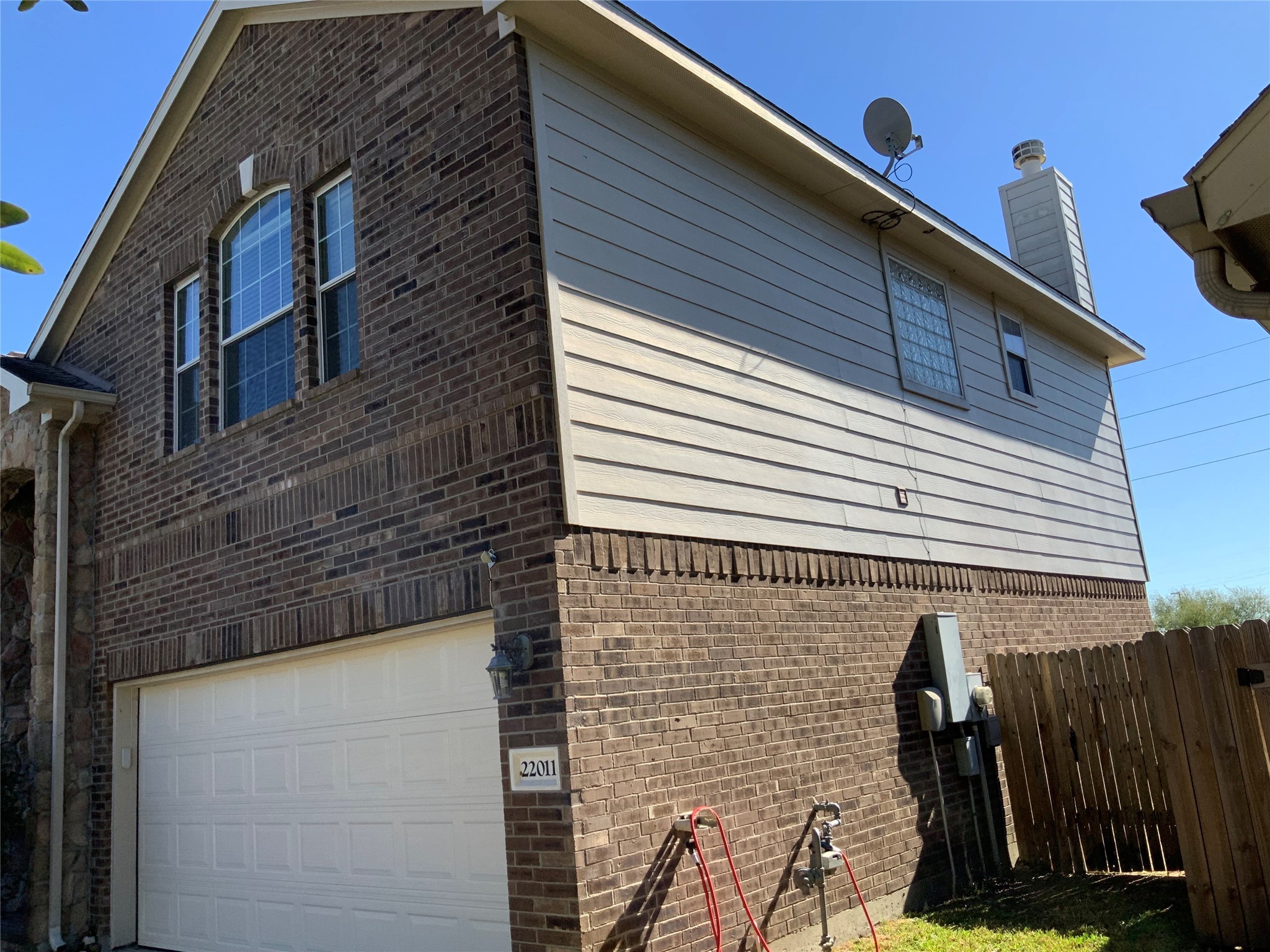 22011 Castle Hawk Trail Richmond, TX 77407 - Photo 2 of 17 a view of a brick wall with a door