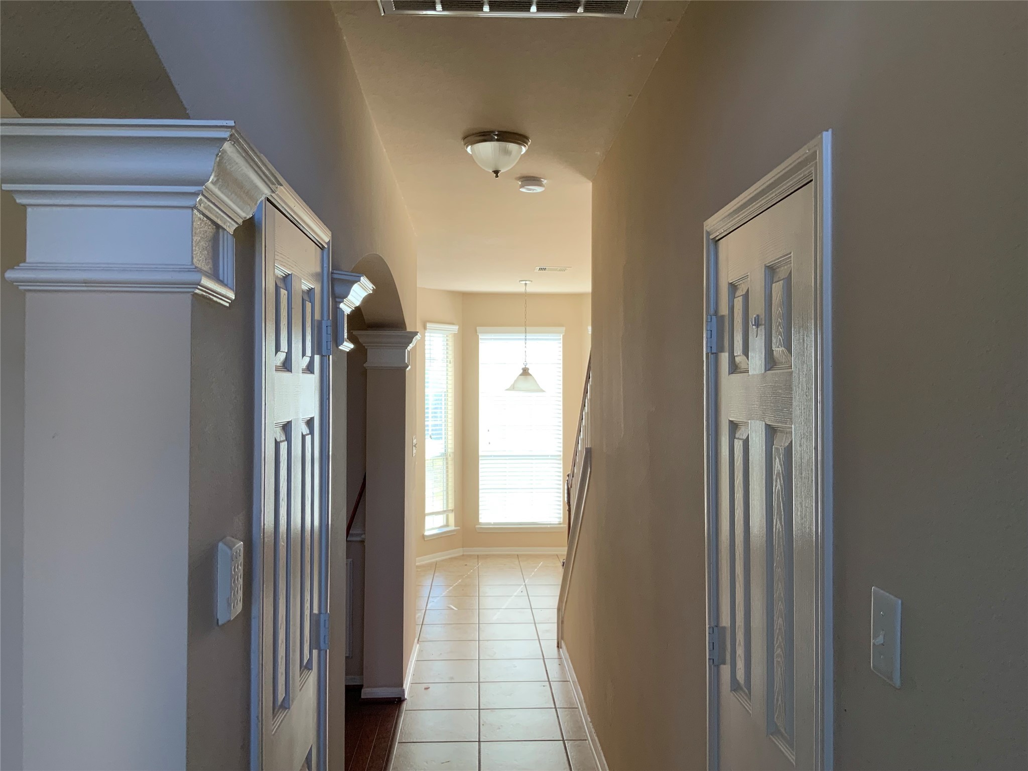 22011 Castle Hawk Trail Richmond, TX 77407 - Photo 7 of 17 a view of a hallway with wooden floor and windows