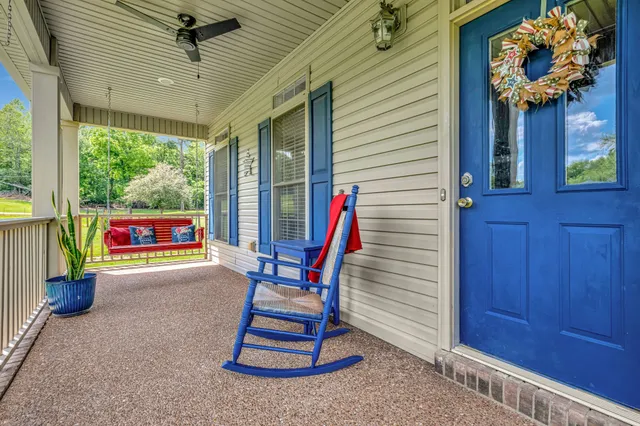a kitchen with stainless steel appliances kitchen island granite countertop a refrigerator and cabinets