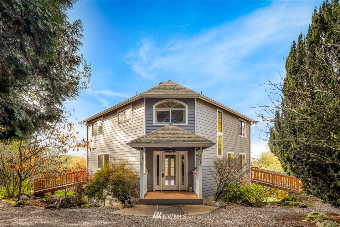 6650 North Star Road Ferndale, WA 98248 - Photo 3 of 40 a front view of a house with garden