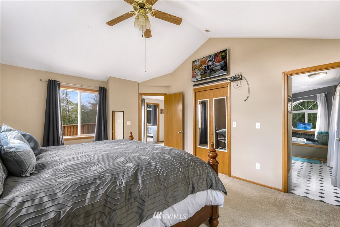 6650 North Star Road Ferndale, WA 98248 - Photo 22 of 40 a bed sitting in a spacious bedroom next to a window
