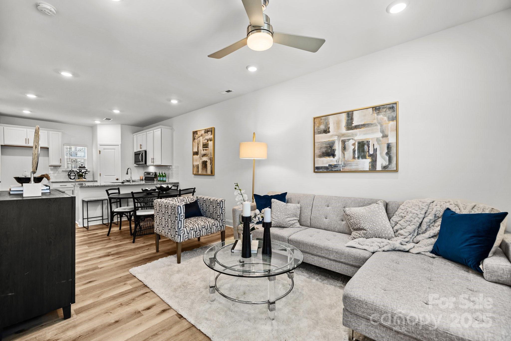 3128 Butler Hl Drive Matthews, NC 28105 - Photo 11 of 24 a living room with furniture kitchen view and a table