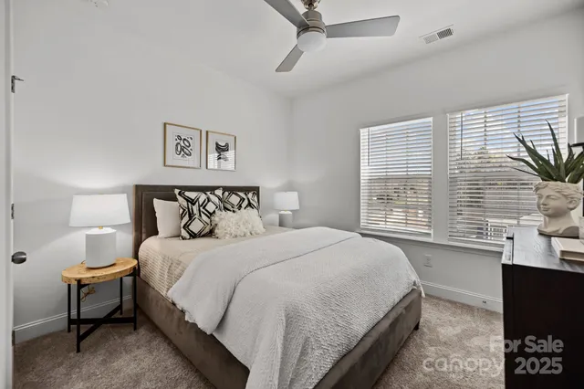 a bedroom with a bed and a table