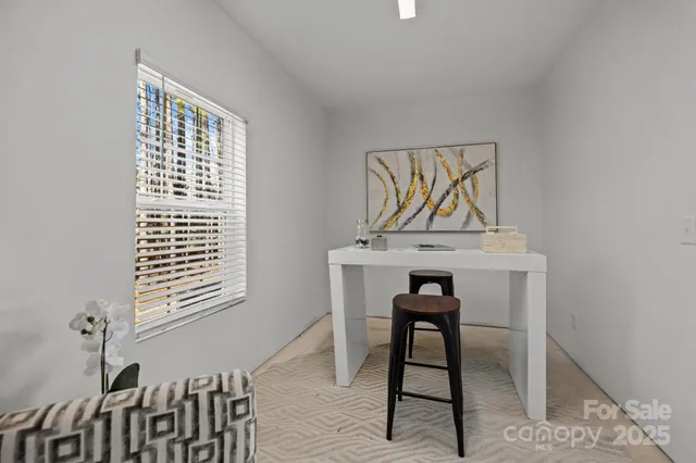 a view of a hallway with seating area