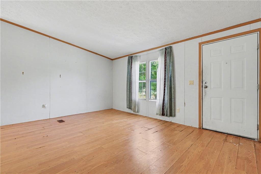 249 John Golden Road Temple, GA 30179 - Photo 15 of 45 a view of an empty room with a window