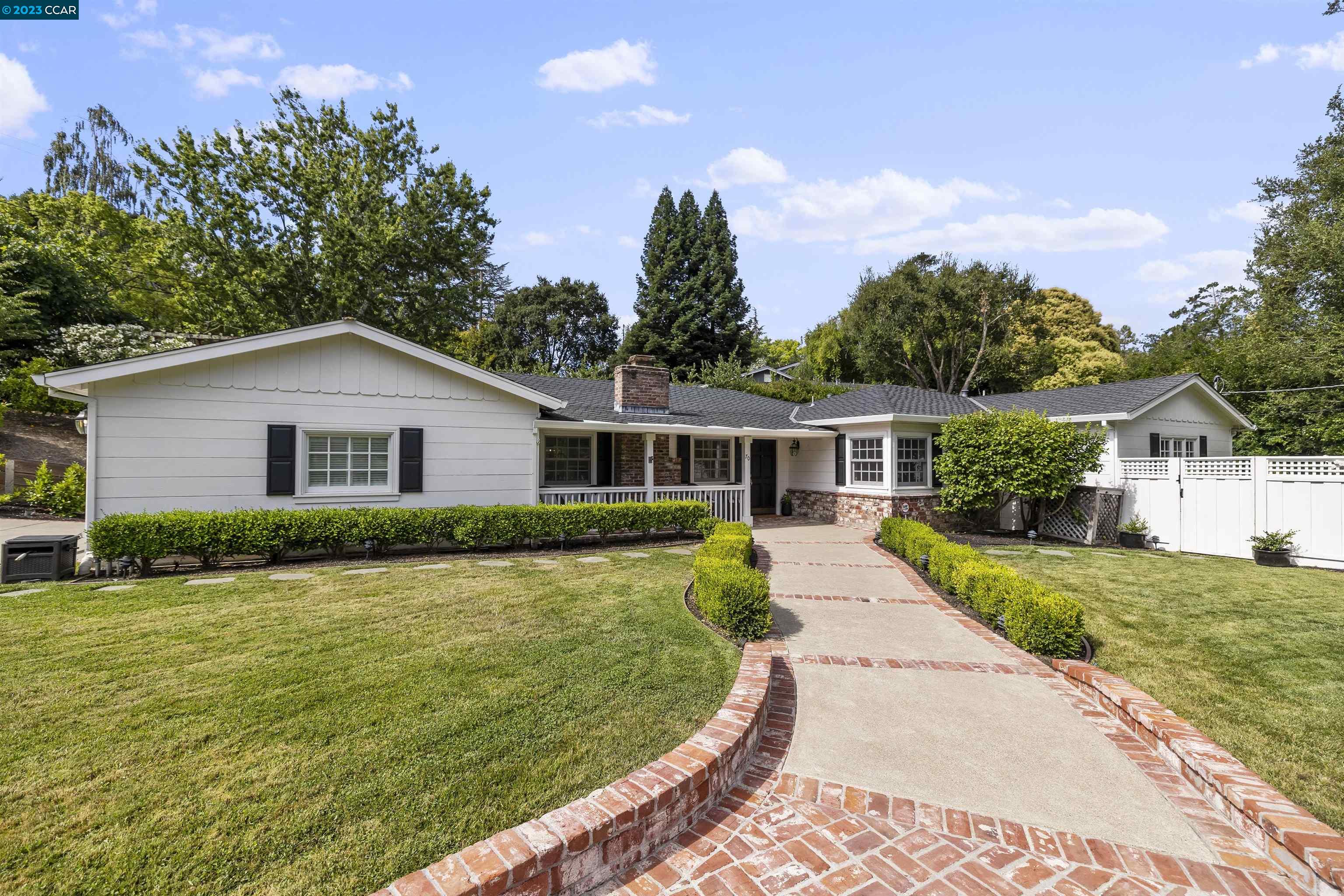 70 Meadow View Road Orinda, CA 94563 - Photo 1 of 1 a front view of a house with a yard