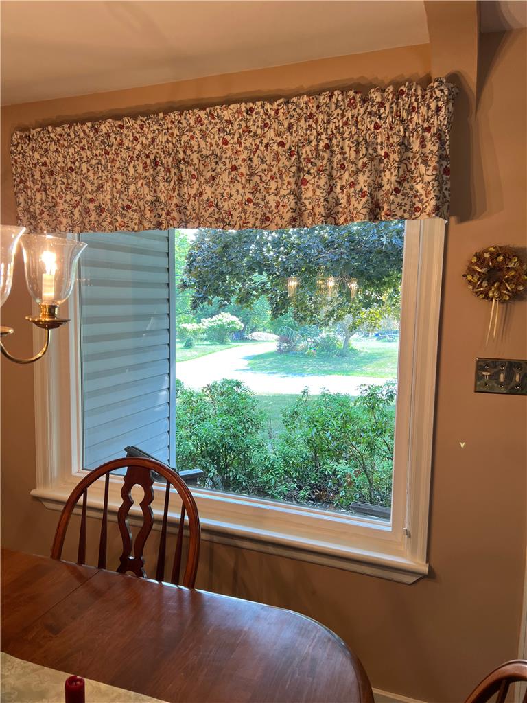 6830 Gun Club Road Coopersburg, PA 18036 - Photo 20 of 30 A well-lit dining area featuring a serene garden view through a broad window.