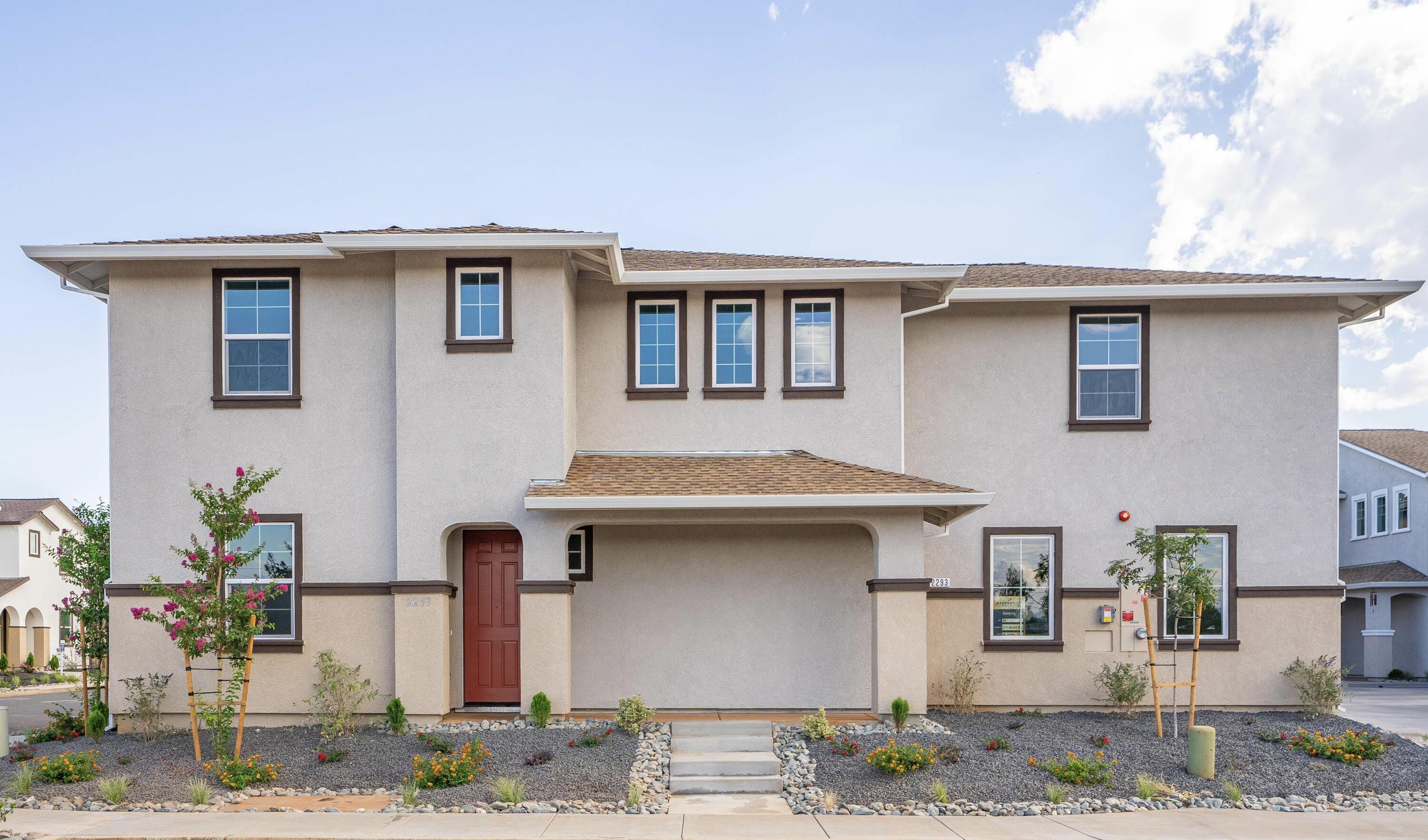 2293 Milano Trail Redding, CA 96003 - Photo 1 of 44 a front view of a house with garden