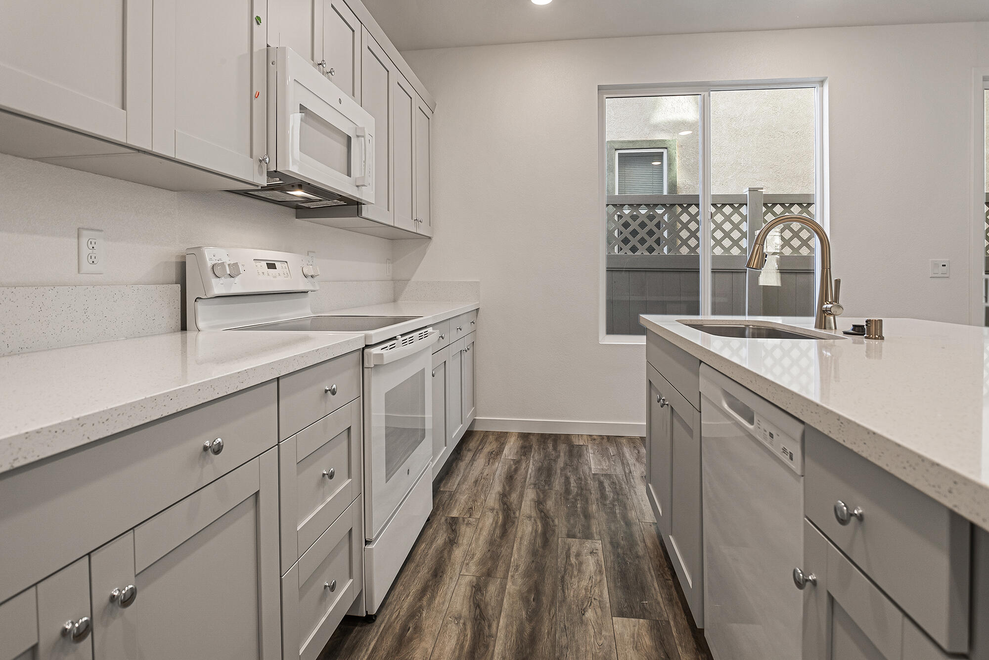 2293 Milano Trail Redding, CA 96003 - Photo 12 of 44 a kitchen with a sink dishwasher and cabinets