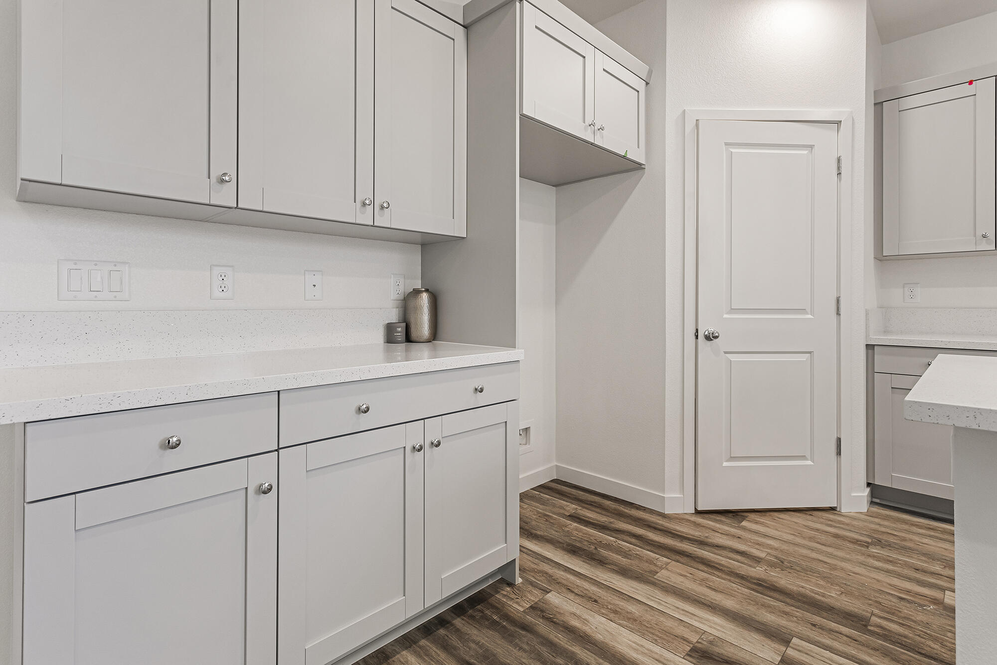 2293 Milano Trail Redding, CA 96003 - Photo 14 of 44 a kitchen with white cabinets and a sink