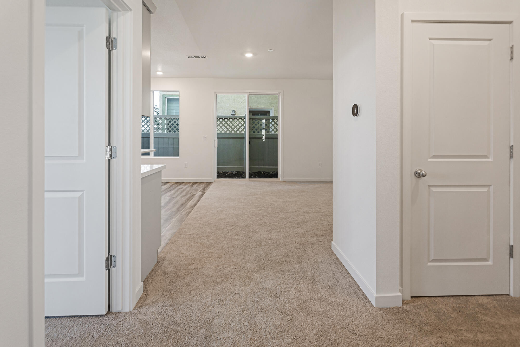2293 Milano Trail Redding, CA 96003 - Photo 16 of 44 a view of a hallway with wooden shelves