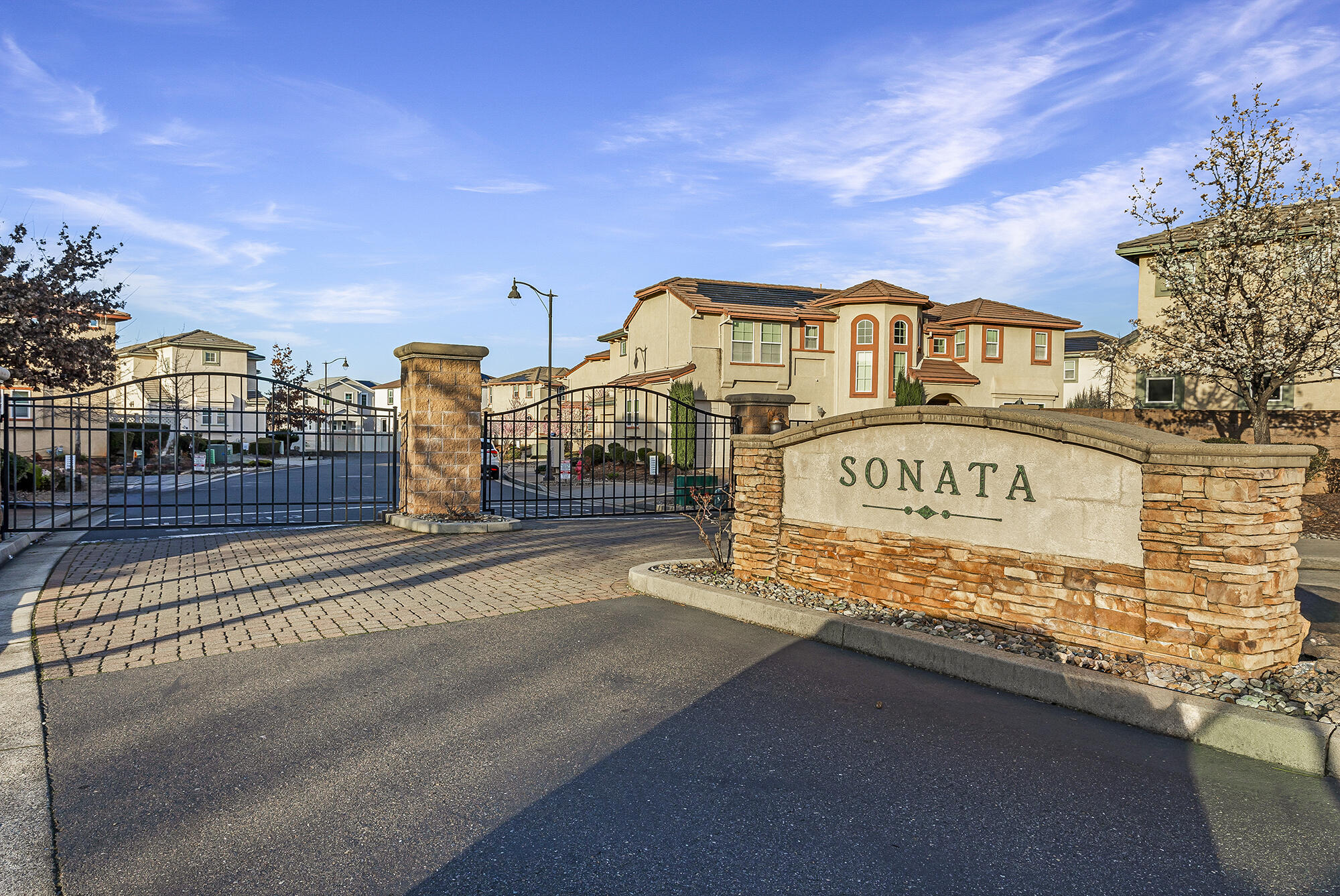 2293 Milano Trail Redding, CA 96003 - Photo 2 of 44 a view of a street with a building in the background