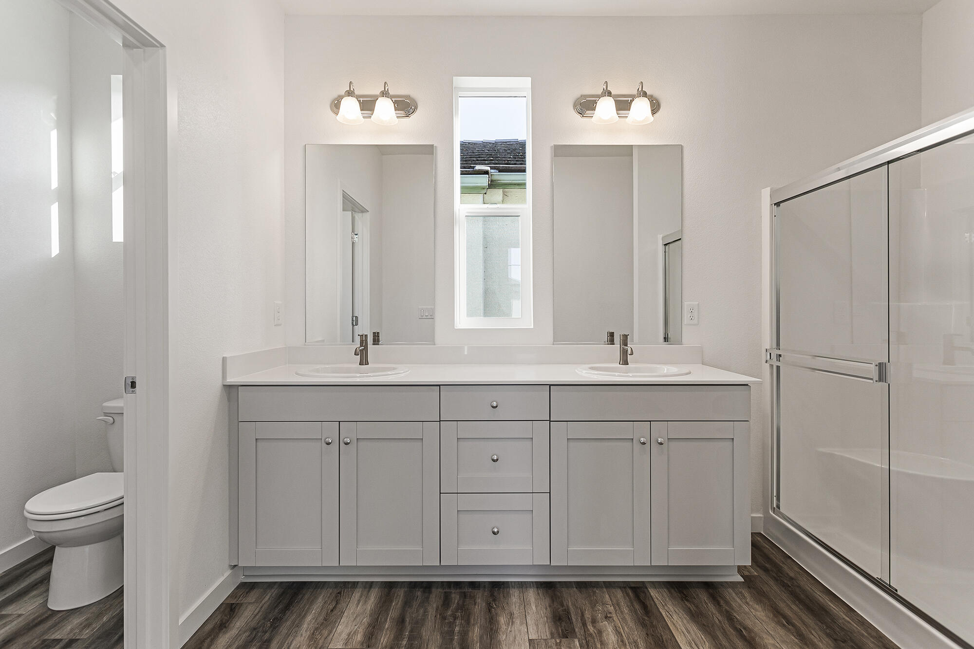 2293 Milano Trail Redding, CA 96003 - Photo 25 of 44 a bathroom with a toilet sink and mirror