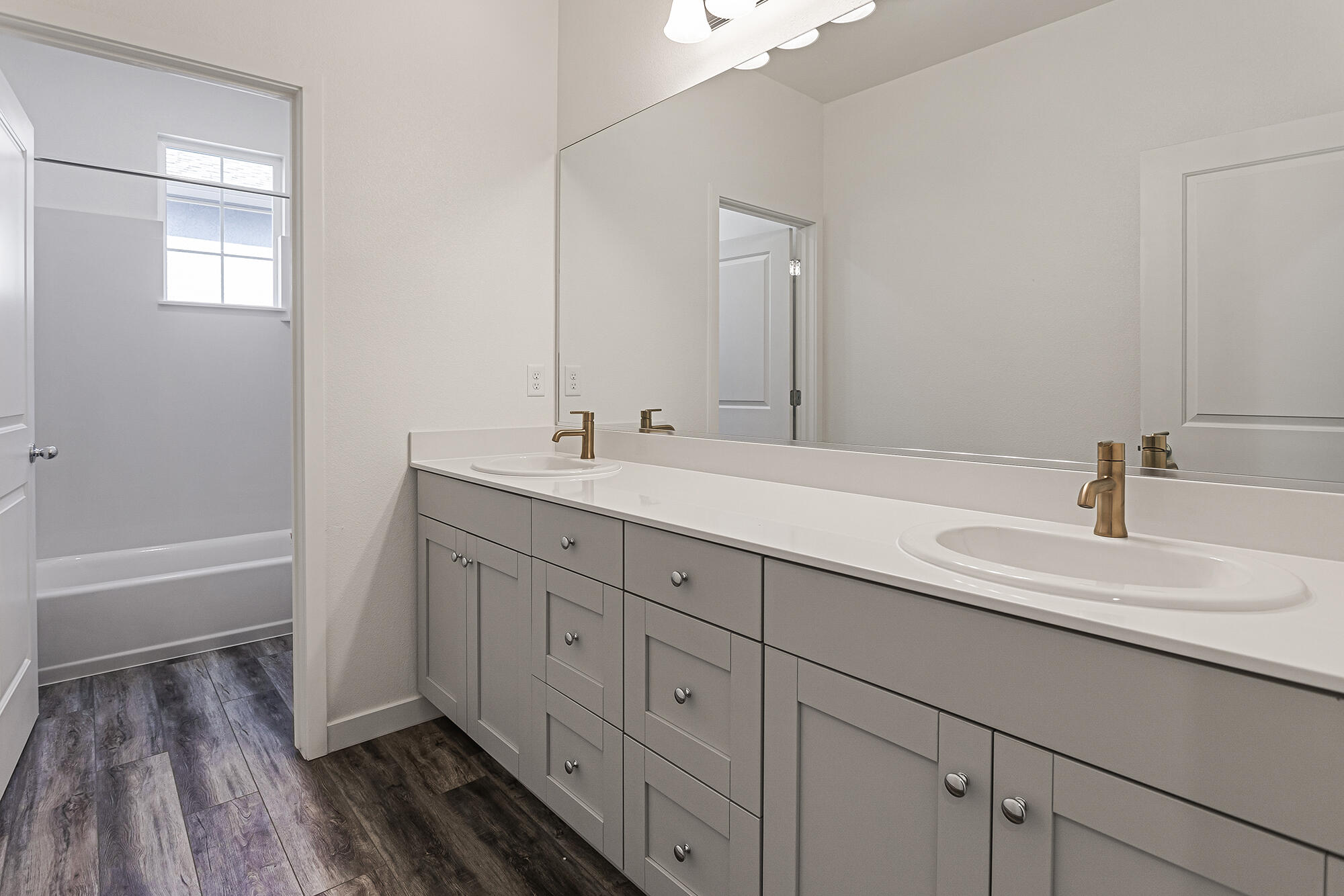 2293 Milano Trail Redding, CA 96003 - Photo 34 of 44 a bathroom with a double vanity sink and mirror