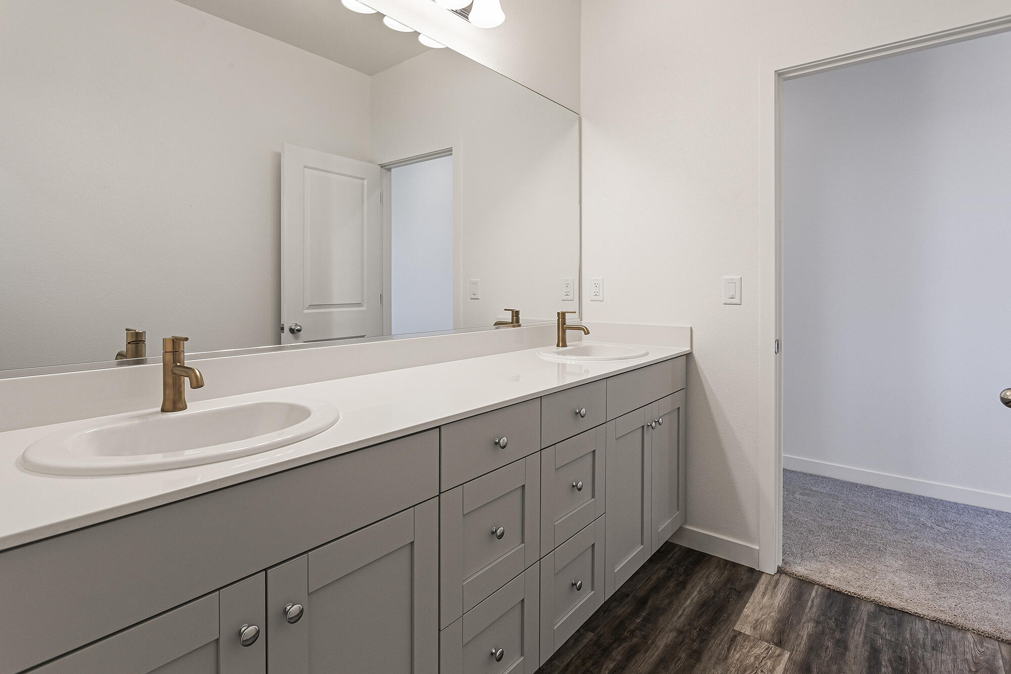 2293 Milano Trail Redding, CA 96003 - Photo 35 of 44 a bathroom with a double vanity sink and mirror