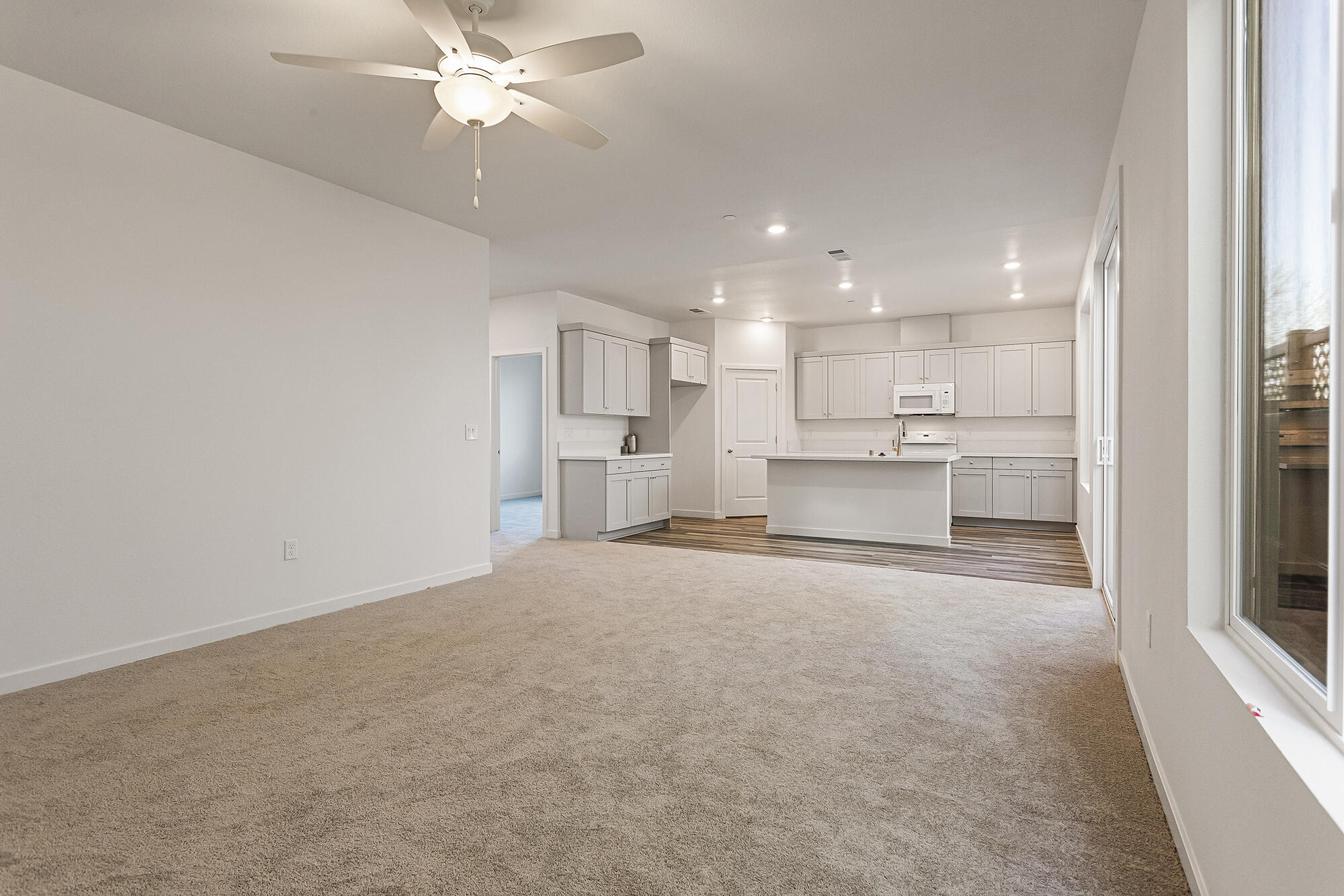 2293 Milano Trail Redding, CA 96003 - Photo 8 of 44 a view of a kitchen with a sink and a refrigerator