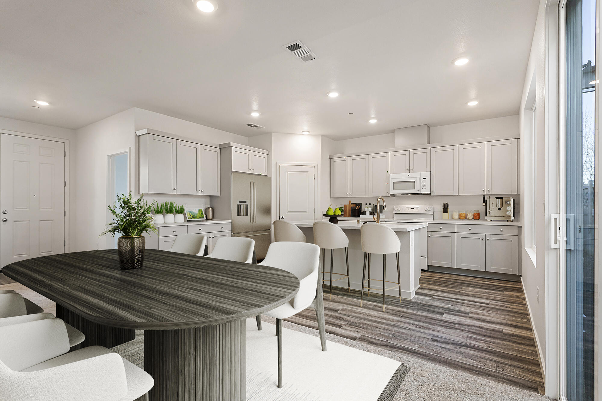 2293 Milano Trail Redding, CA 96003 - Photo 9 of 44 a kitchen with a table chairs sink and cabinets