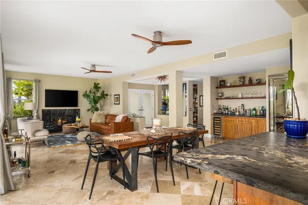 a kitchen with stainless steel appliances granite countertop sink stove and refrigerator
