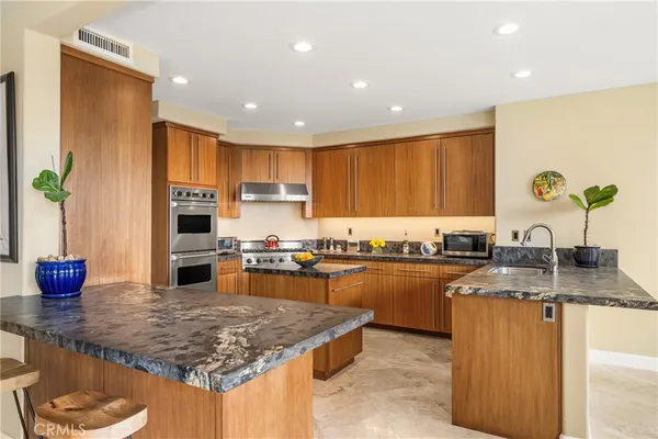 a kitchen with a stove and cabinets