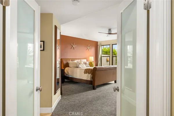 a view of walk in closet with clothes