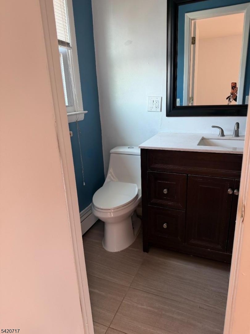 2538 Spruce Street, Unit 2 Union, NJ 07083 - Photo 12 of 29 a bathroom with a toilet sink and mirror