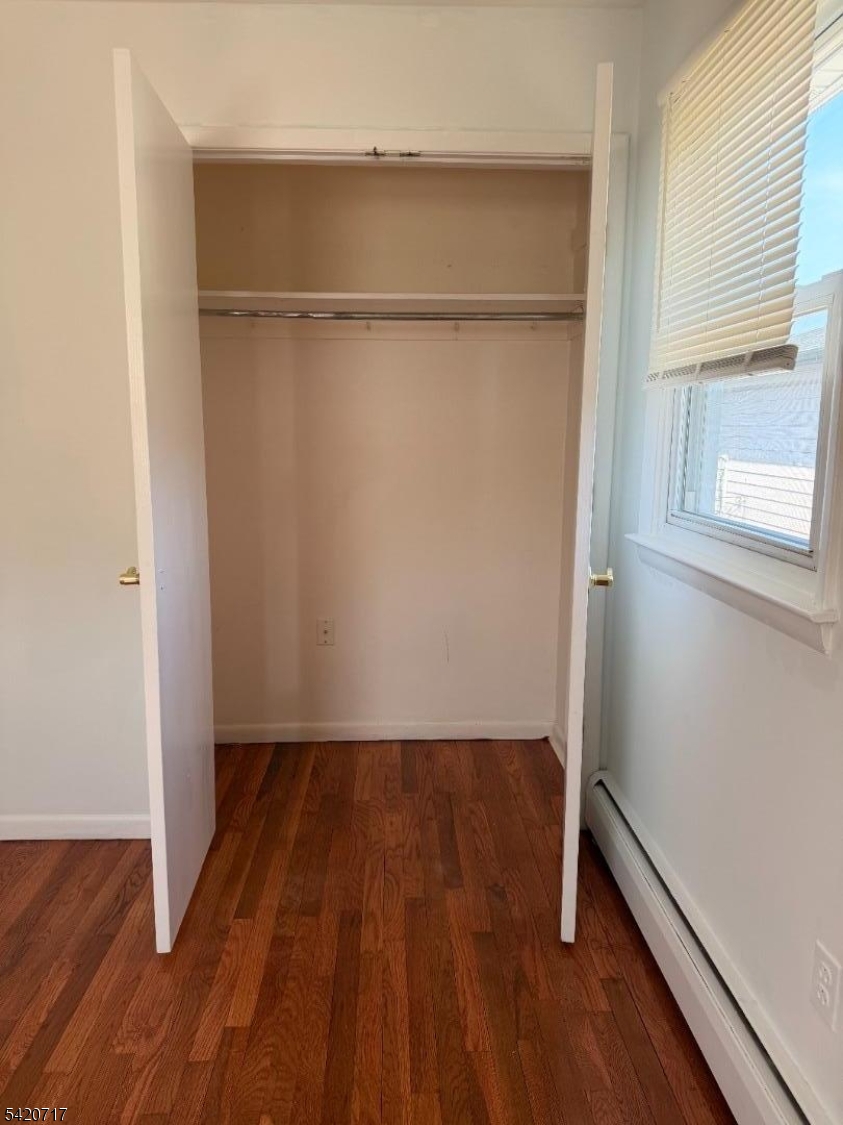 2538 Spruce Street, Unit 2 Union, NJ 07083 - Photo 17 of 29 a view of an empty room with wooden floor and a window