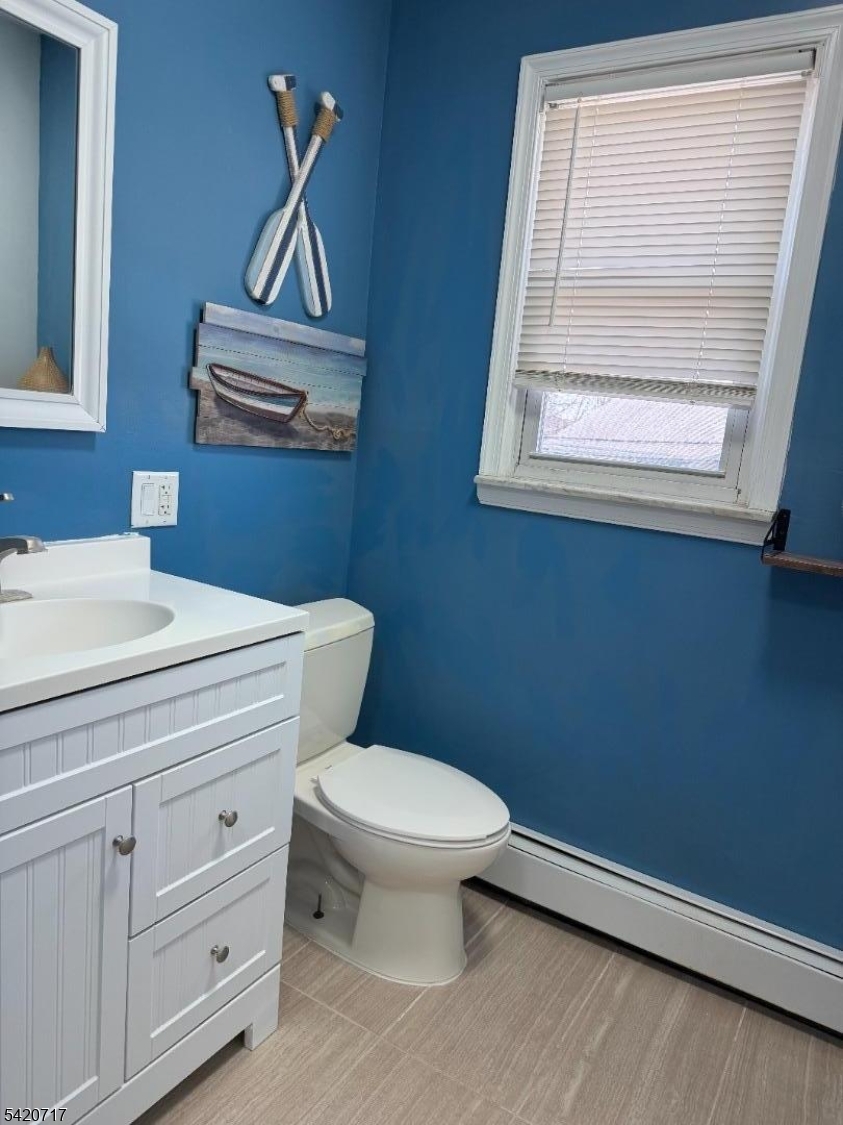 2538 Spruce Street, Unit 2 Union, NJ 07083 - Photo 19 of 29 a bathroom with a toilet a sink and a window