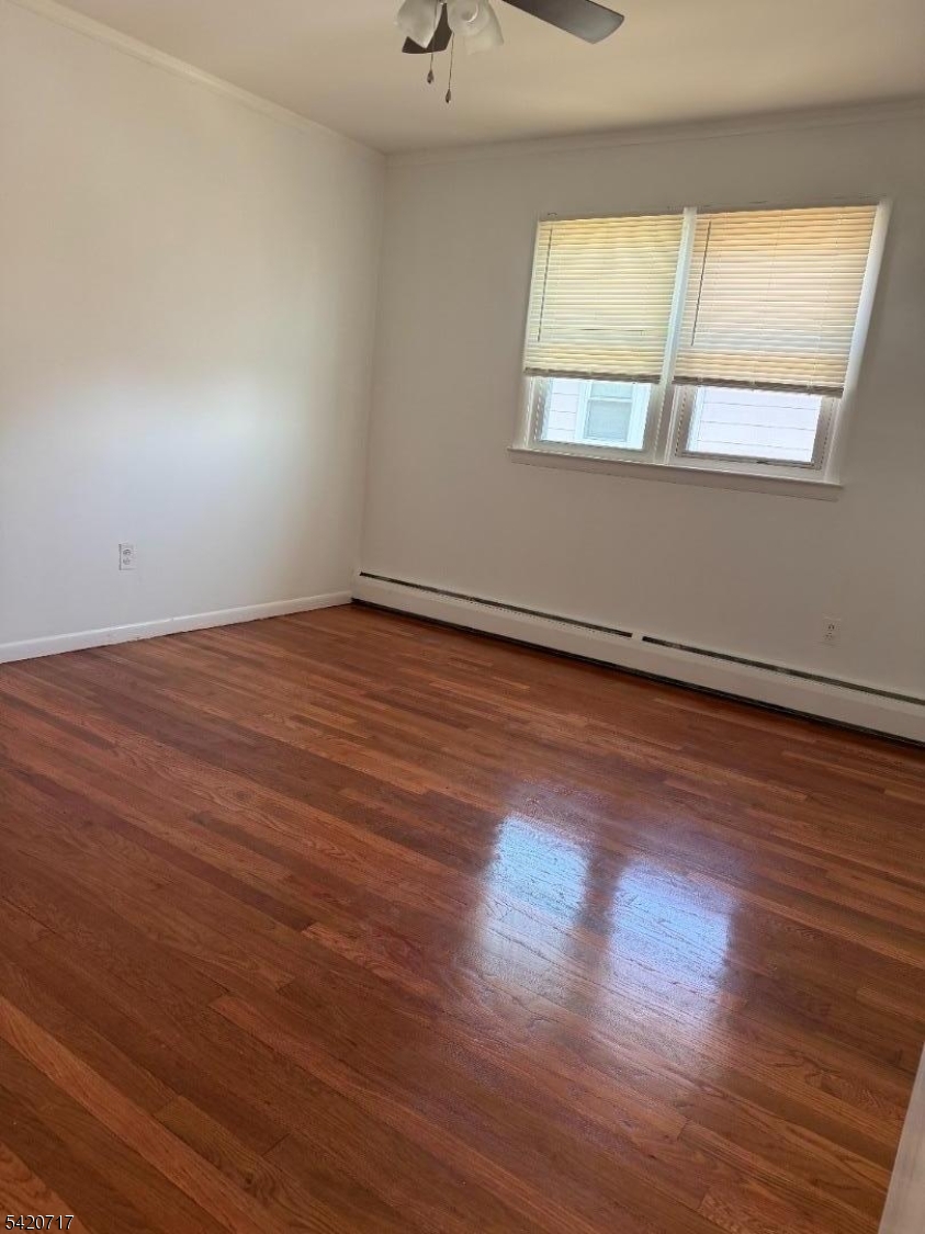 2538 Spruce Street, Unit 2 Union, NJ 07083 - Photo 20 of 29 a view of an empty room with wooden floor and a window