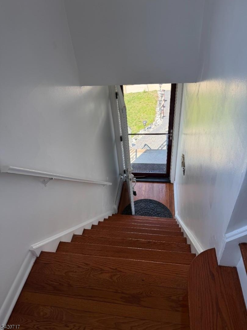 2538 Spruce Street, Unit 2 Union, NJ 07083 - Photo 9 of 29 a bed sitting in a bedroom next to a window