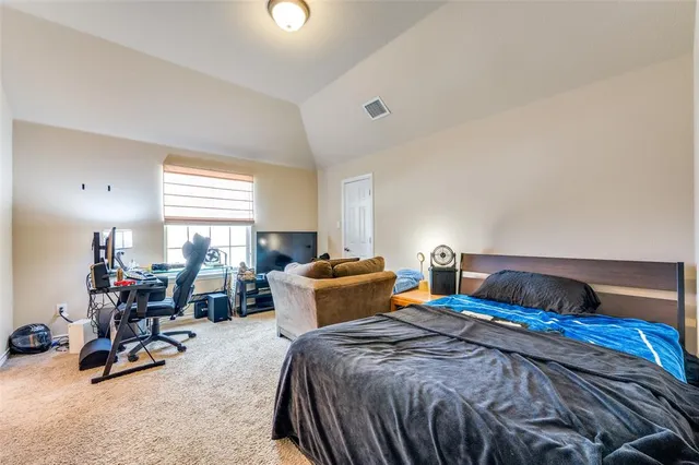 a bedroom with two beds and a large window with the outer view