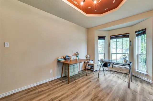 a view of a livingroom with furniture and wooden floor