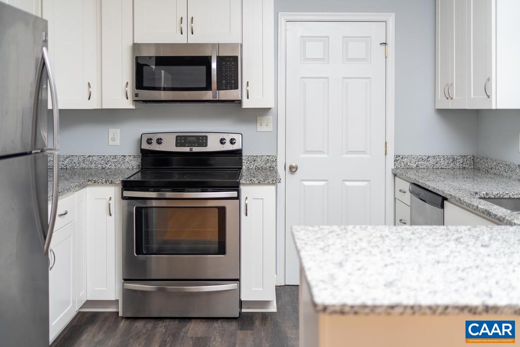 15 East Point Road Palmyra, VA 22963 - Photo 18 of 48 a kitchen with stainless steel appliances granite countertop a stove and a refrigerator