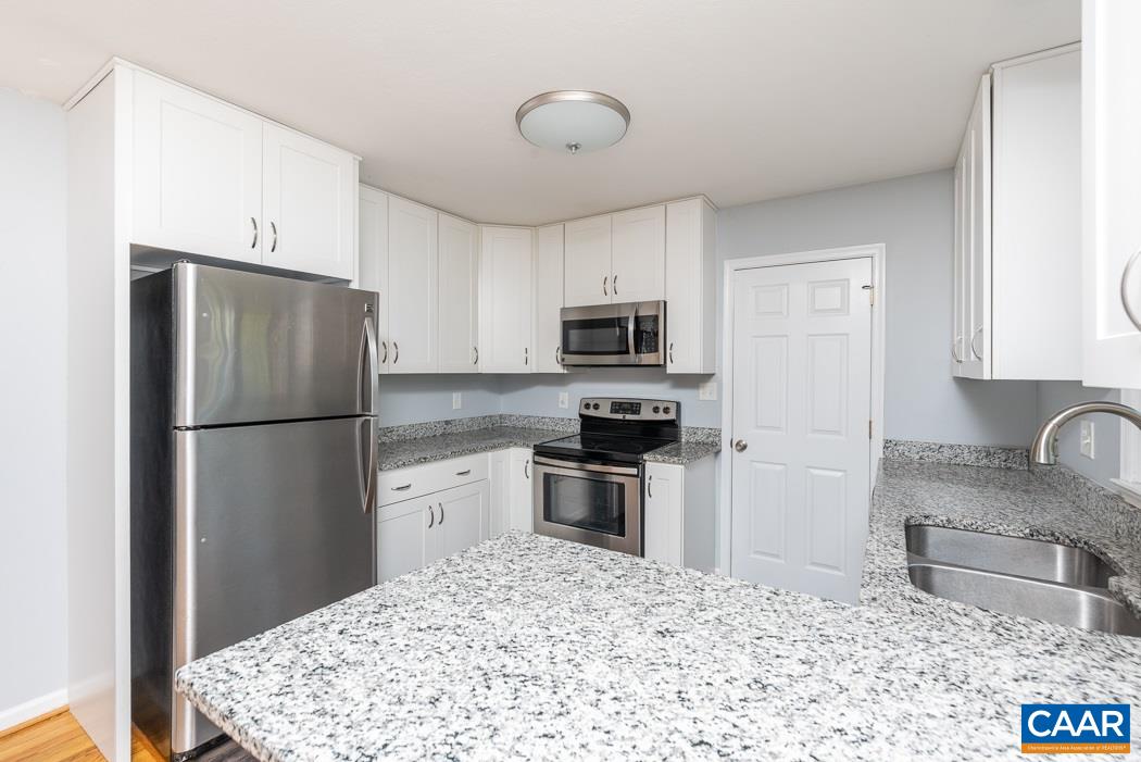 15 East Point Road Palmyra, VA 22963 - Photo 20 of 48 a kitchen with stainless steel appliances granite countertop a refrigerator sink and stove