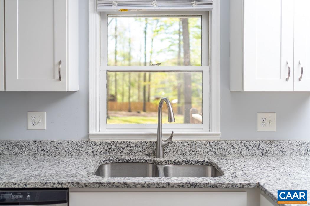 15 East Point Road Palmyra, VA 22963 - Photo 22 of 48 a kitchen with granite countertop a sink and a window