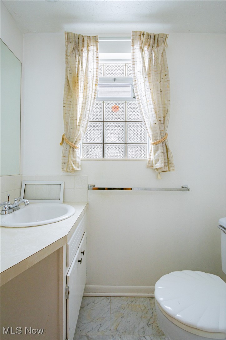 5905 Renninger Road New Franklin, OH 44319 - Photo 22 of 31 Bathroom featuring vanity and toilet