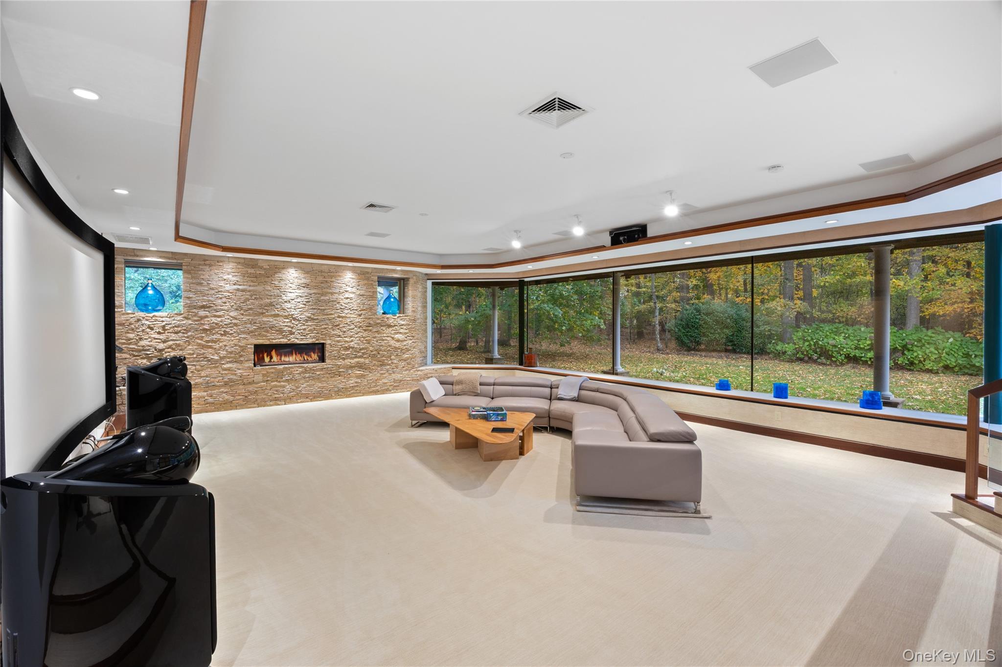 18 Golf Club Road St. James, NY 11780 - Photo 16 of 47 a swimming pool with large trees and a couch