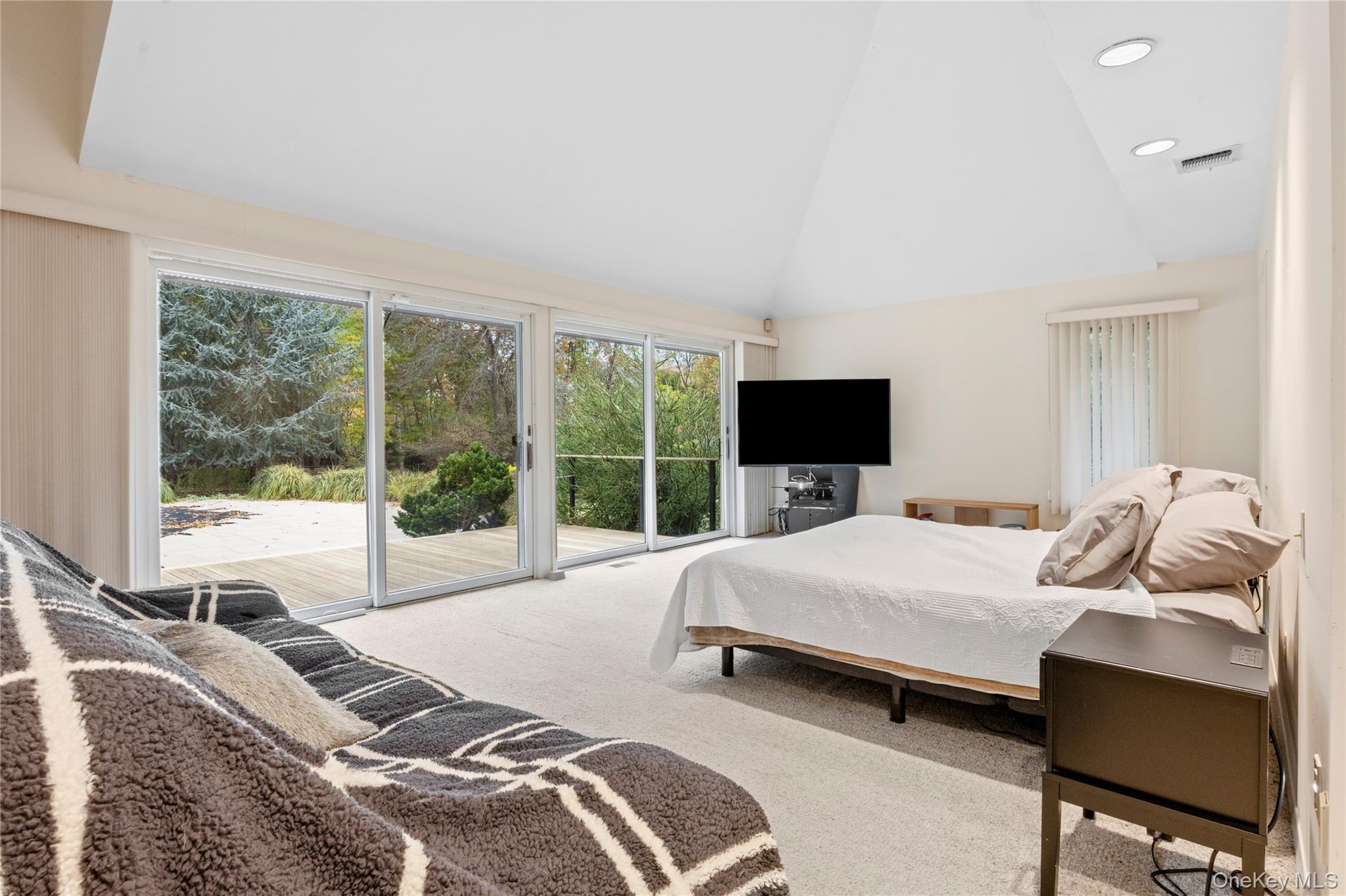 18 Golf Club Road St. James, NY 11780 - Photo 17 of 47 a bedroom with a bed and large window