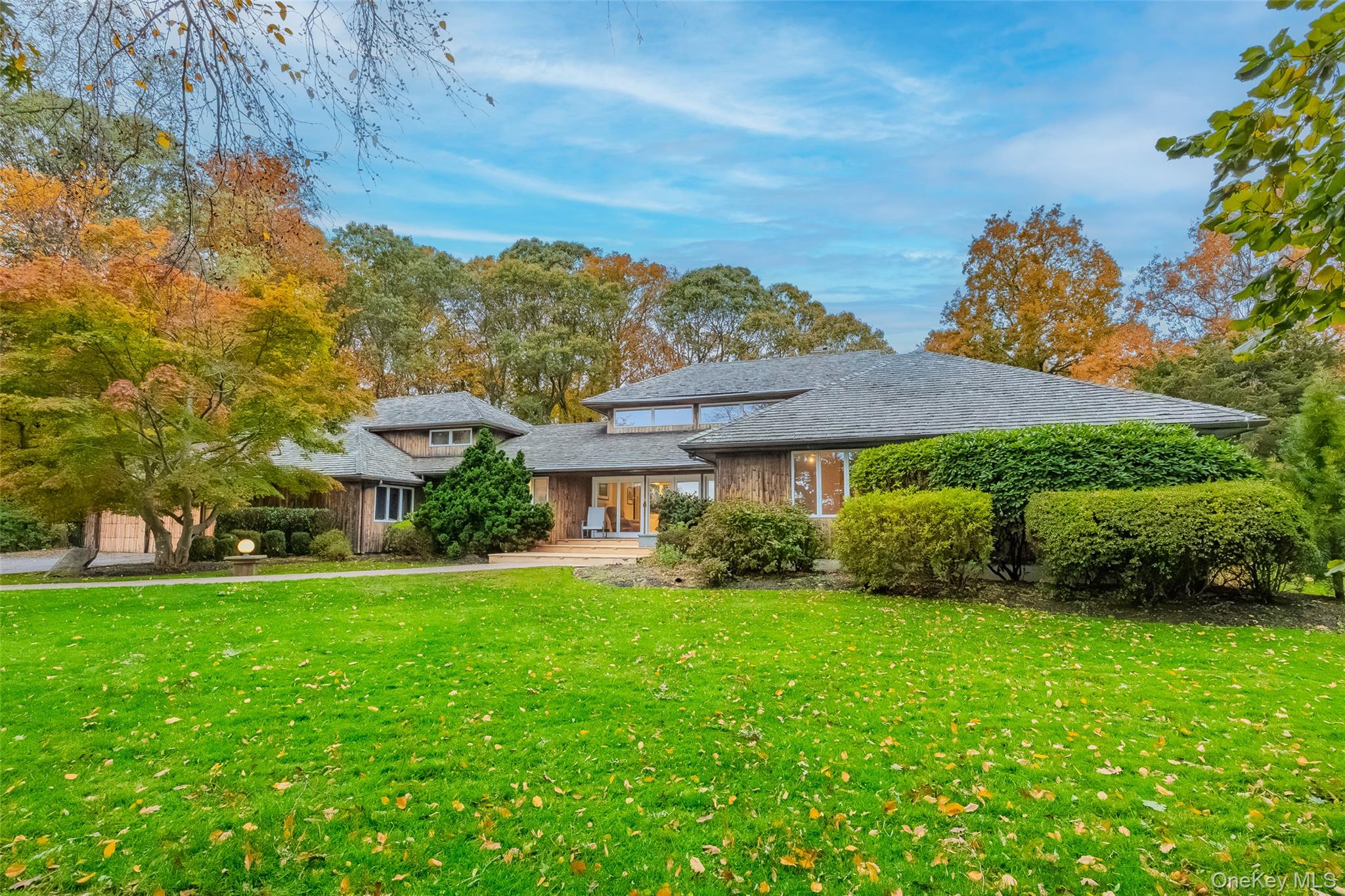 18 Golf Club Road St. James, NY 11780 - Photo 2 of 47 a view of a house with a garden