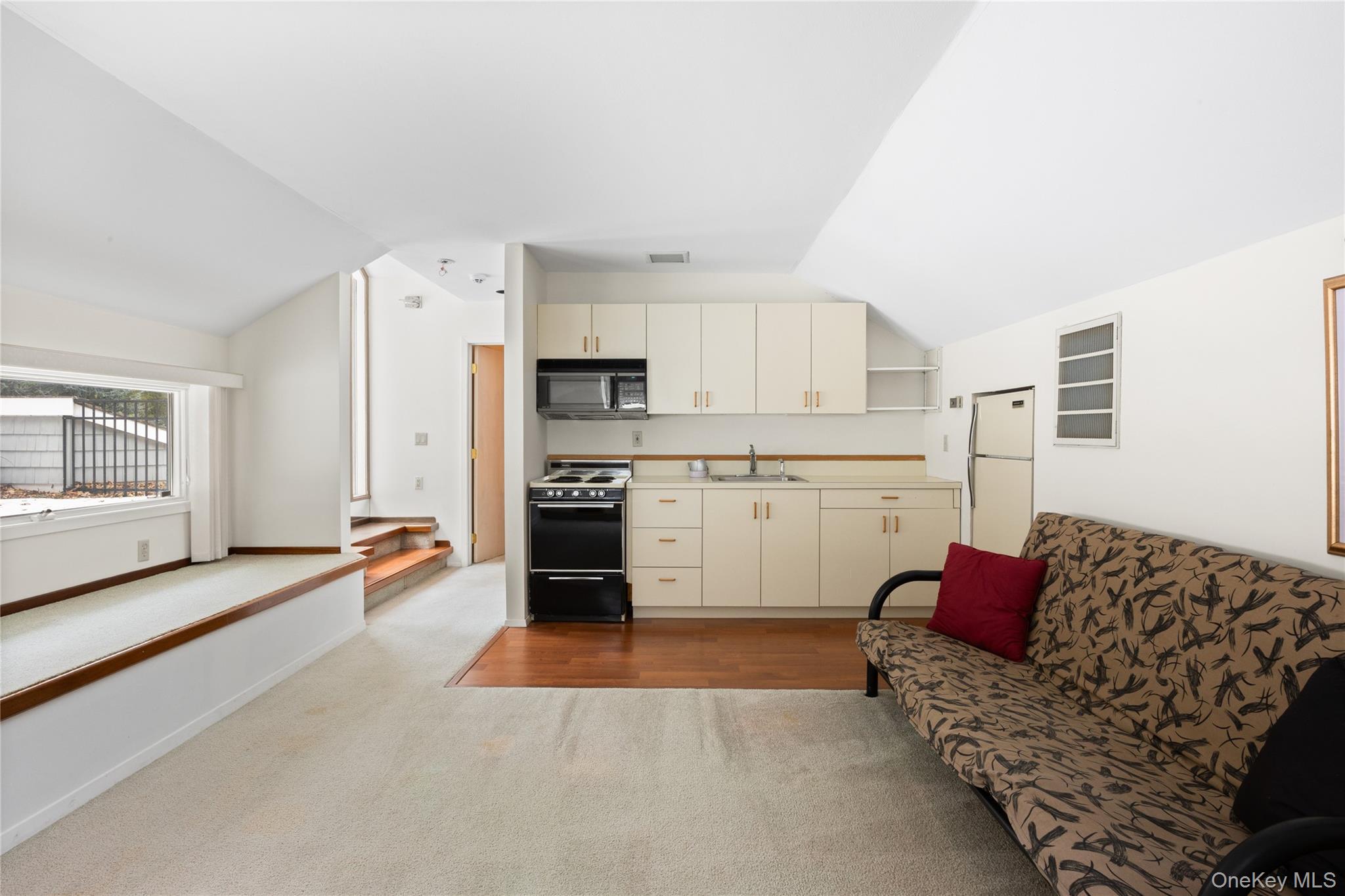 18 Golf Club Road St. James, NY 11780 - Photo 23 of 47 a living room with furniture and kitchen view