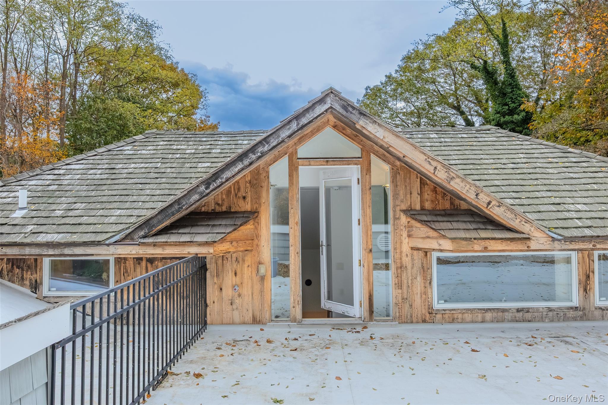 18 Golf Club Road St. James, NY 11780 - Photo 30 of 47 a front view of a house with garage